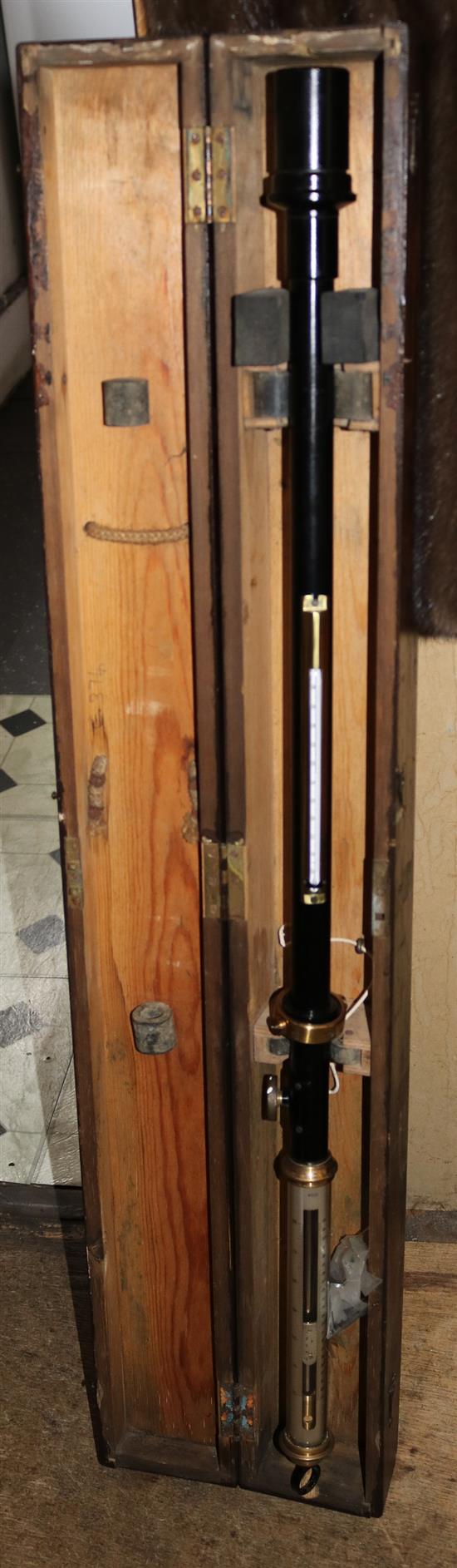 A lacquered marine stick barometer cased with gimble